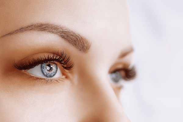 Closeup of a woman's beautiful blue eyes and perfectly sculpted eyebrows