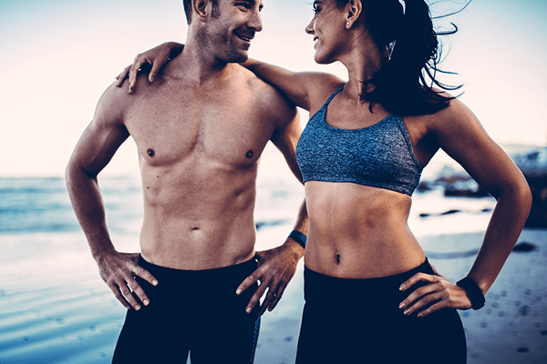 Man and woman with fit bodies ready with surgical body shaping procedures